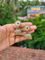 Elegant Oxidized Gold Stone-Studded Jhumka Earrings - Black