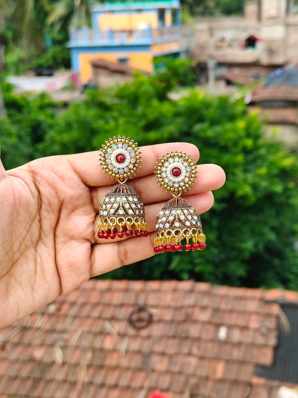 Elegant Oxidized Gold Stone-Studded Jhumka Earrings - Maroon
