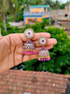 Elegant Oxidized Gold Stone-Studded Jhumka Earrings - Pink
